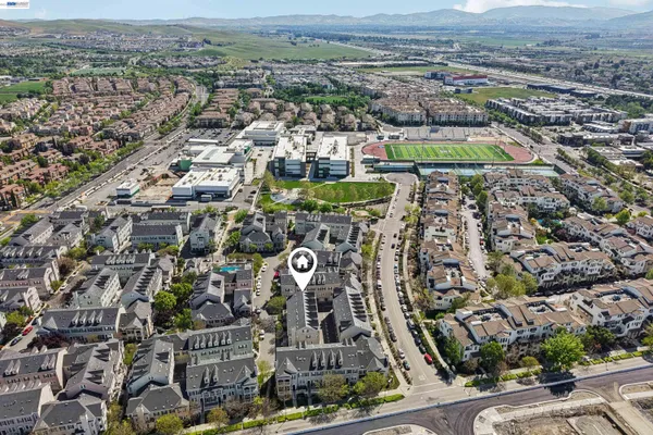 an aerial view of a city with lots of residential buildings