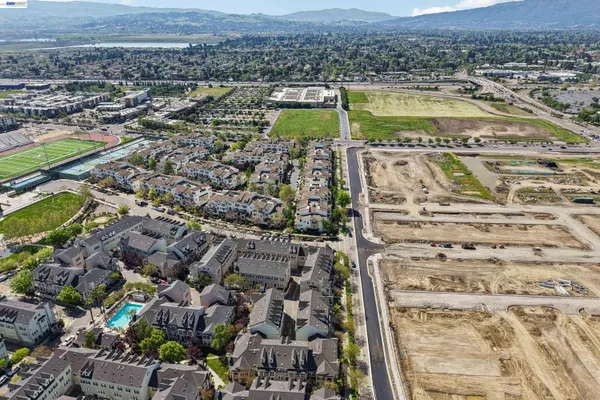 an aerial view of residential houses with outdoor space