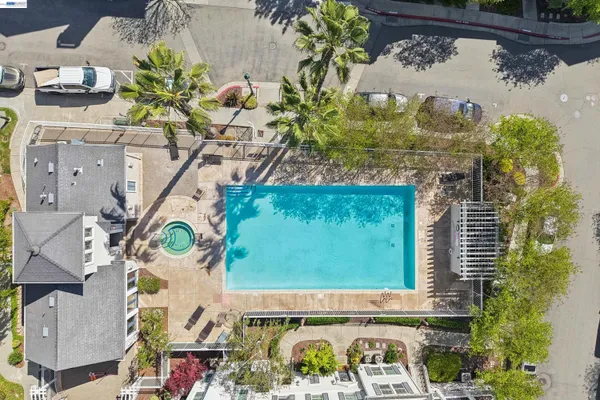 an aerial view of a residential apartment building with a yard