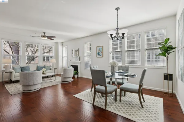 a view of a livingroom with furniture window and wooden floor