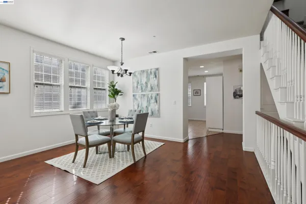 a view of a dining room with furniture window and wooden floor