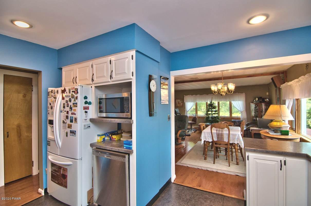 2370 Wrighter Lake Road Thompson, PA 18465 - Photo 29 of 106 Kitchen into Dining Room