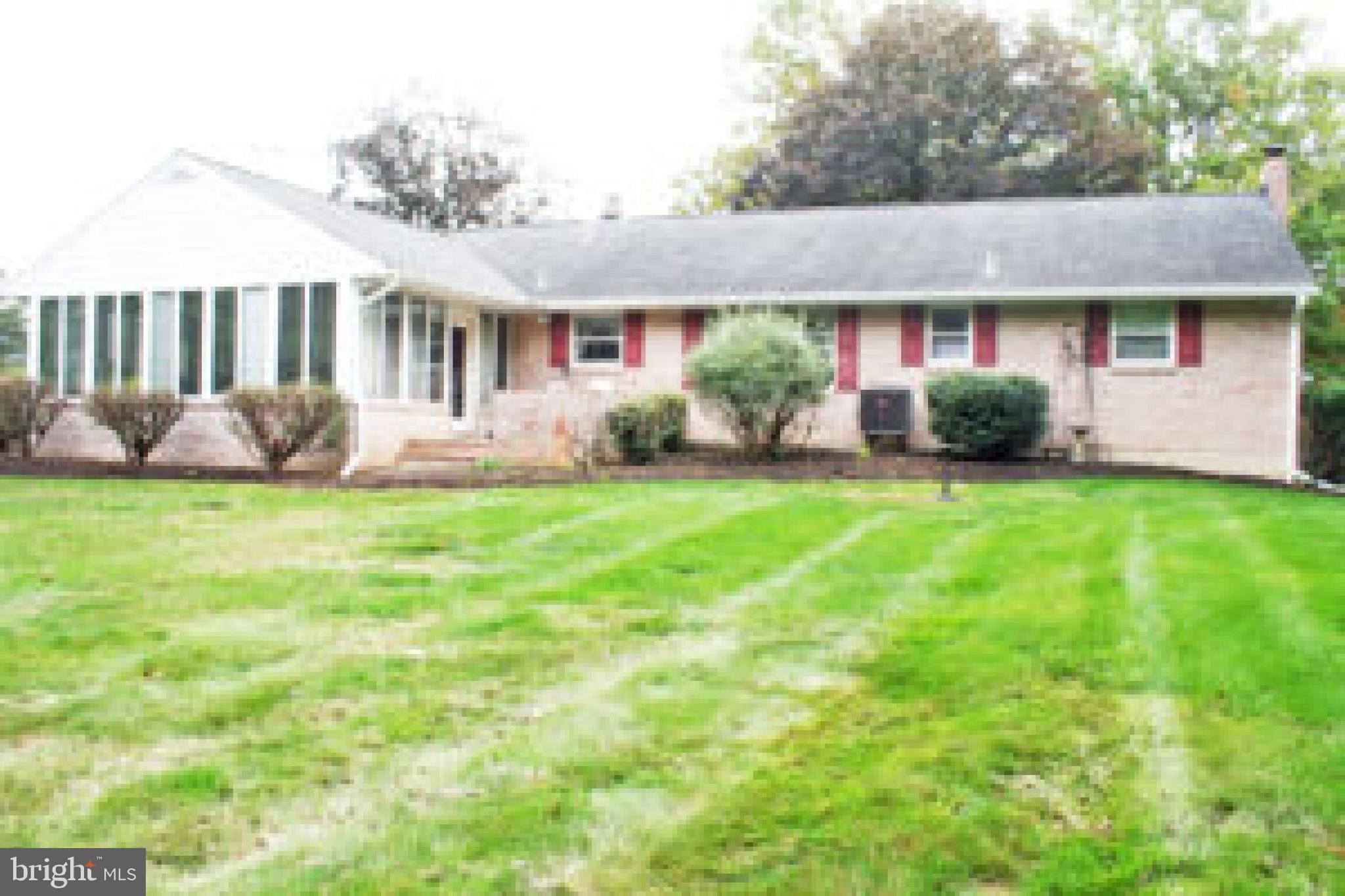 914 May Road Lititz, PA 17543 - Photo 5 of 8 a front view of a house with a yard and garage
