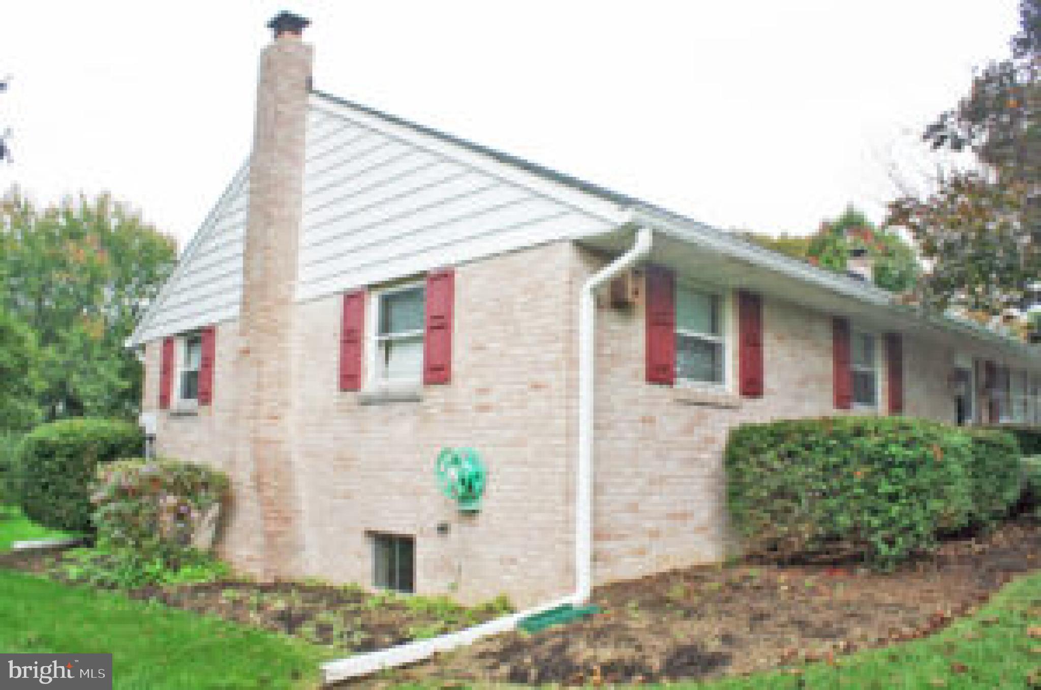 914 May Road Lititz, PA 17543 - Photo 6 of 8 a front view of a house with potted plants