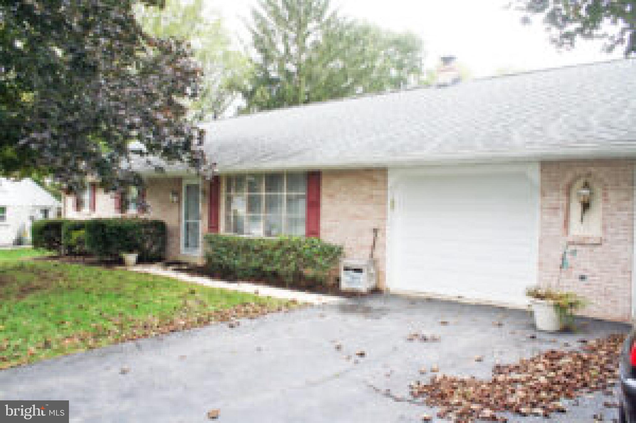 914 May Road Lititz, PA 17543 - Photo 8 of 8 a front view of a house with a yard and potted plants