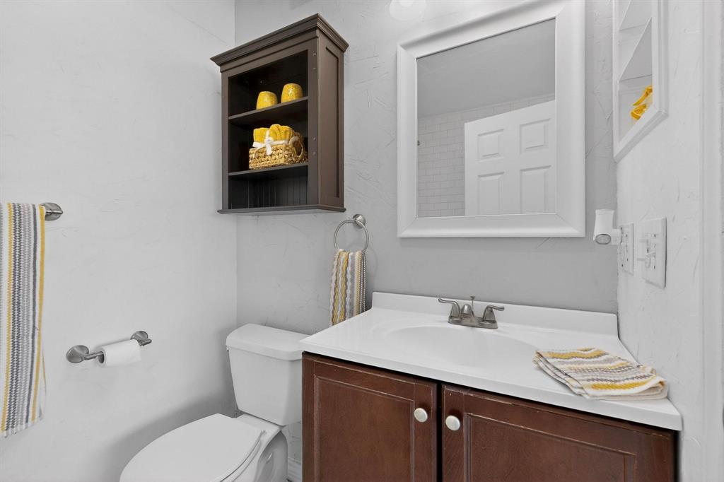 8404 Forest Lane, Unit 1305 Dallas, TX 75243 - Photo 20 of 32 a bathroom with a sink and a toilet