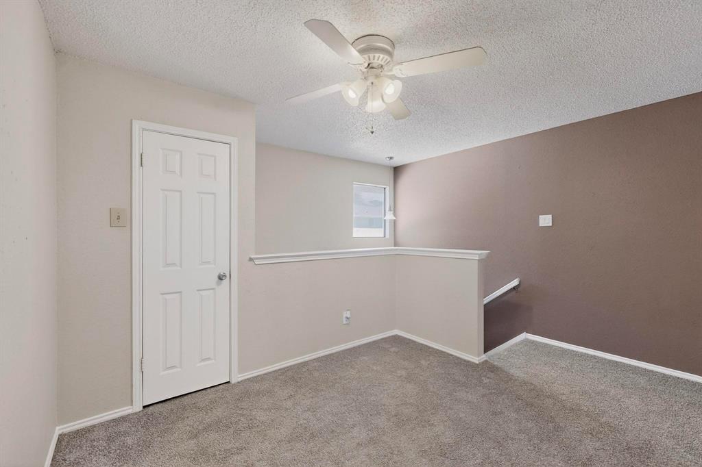 8404 Forest Lane, Unit 1305 Dallas, TX 75243 - Photo 23 of 32 an empty room with closet and windows