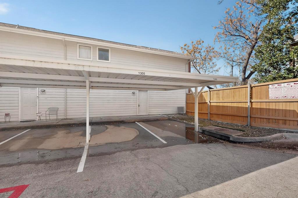 8404 Forest Lane, Unit 1305 Dallas, TX 75243 - Photo 28 of 32 a view of a garage