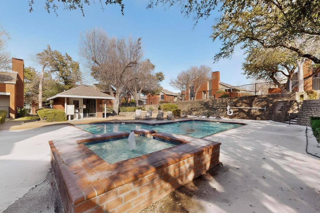 8404 Forest Lane, Unit 1305 Dallas, TX 75243 - Photo 29 of 32 a view of a swimming pool with outdoor seating