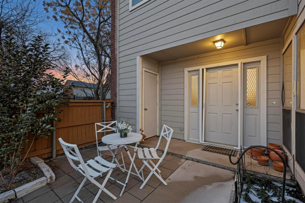 8404 Forest Lane, Unit 1305 Dallas, TX 75243 - Photo 31 of 32 a view of a patio with chair and table