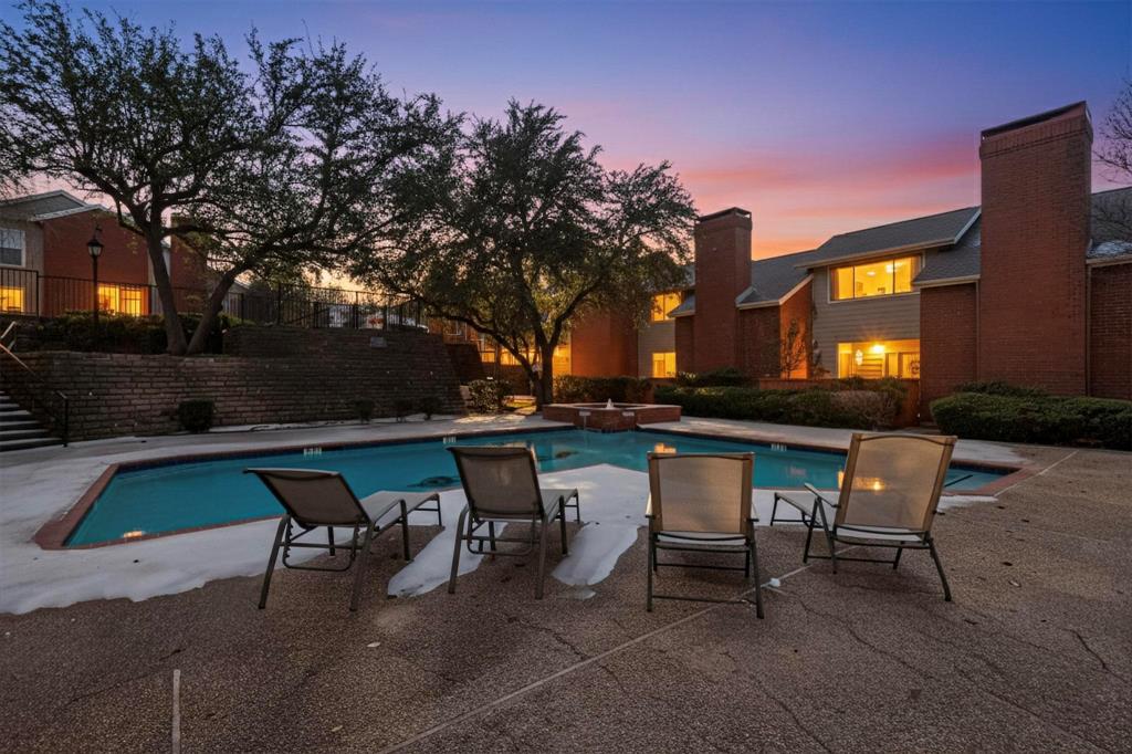 8404 Forest Lane, Unit 1305 Dallas, TX 75243 - Photo 32 of 32 a backyard of a house with table and chairs