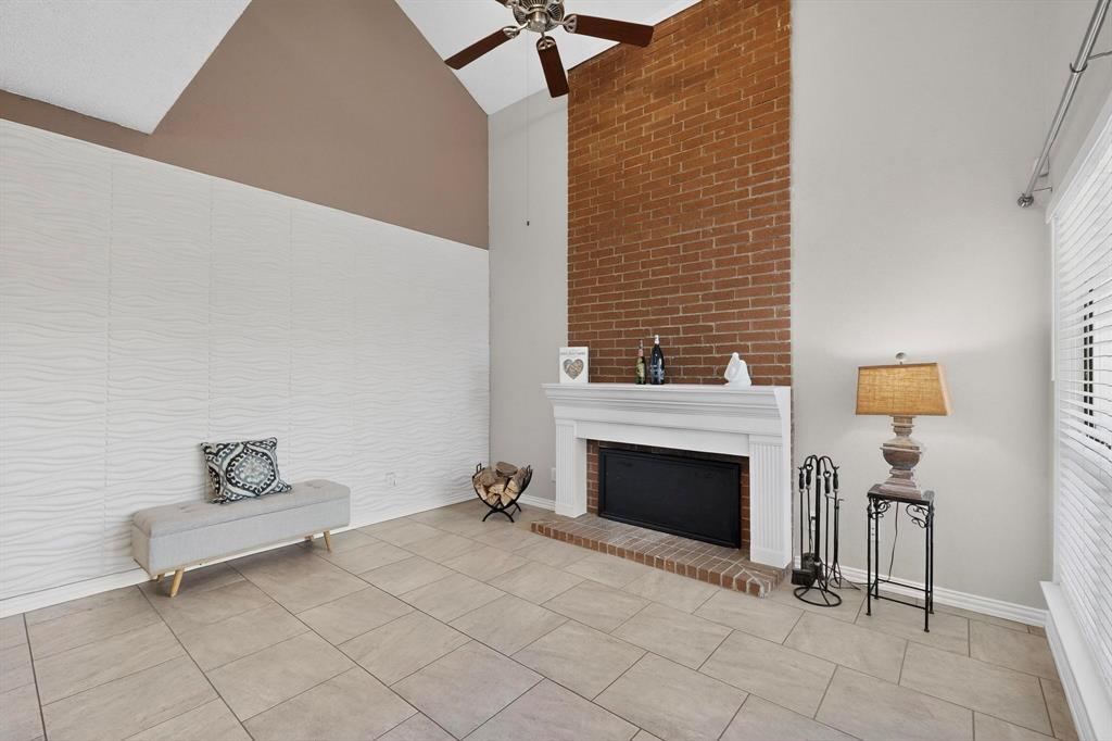 8404 Forest Lane, Unit 1305 Dallas, TX 75243 - Photo 10 of 32 a living room with furniture and a fireplace