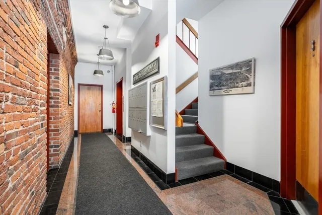 a view of a hallway with staircase