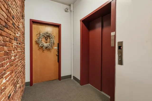an empty room with wooden floor and closet