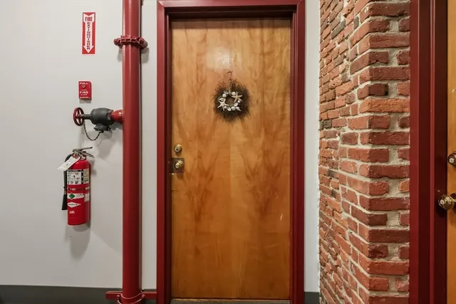 a bathroom with a shower and a door