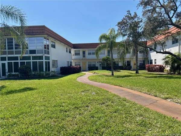 a view of a house with a big yard