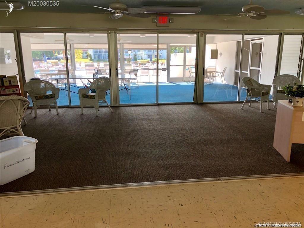 1225 Northwest 21st Street, Unit 353509 Stuart, FL 34994 - Photo 11 of 15 a living room with furniture