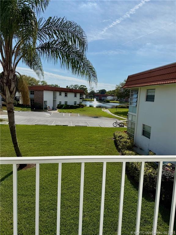 1225 Northwest 21st Street, Unit 353509 Stuart, FL 34994 - Photo 15 of 15 a view of a house with a yard