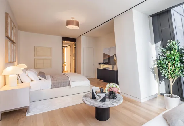 a bathroom with a double vanity sink toilet and a shower