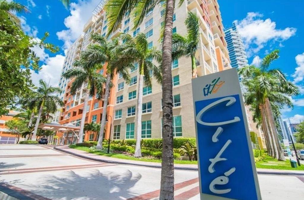 2000 North Bayshore Drive, Unit 407 Miami, FL 33137 - Photo 1 of 19 a front view of a multi story residential apartment building with a yard