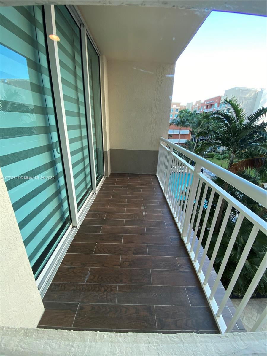 2000 North Bayshore Drive, Unit 407 Miami, FL 33137 - Photo 13 of 19 a view of balcony with wooden floor