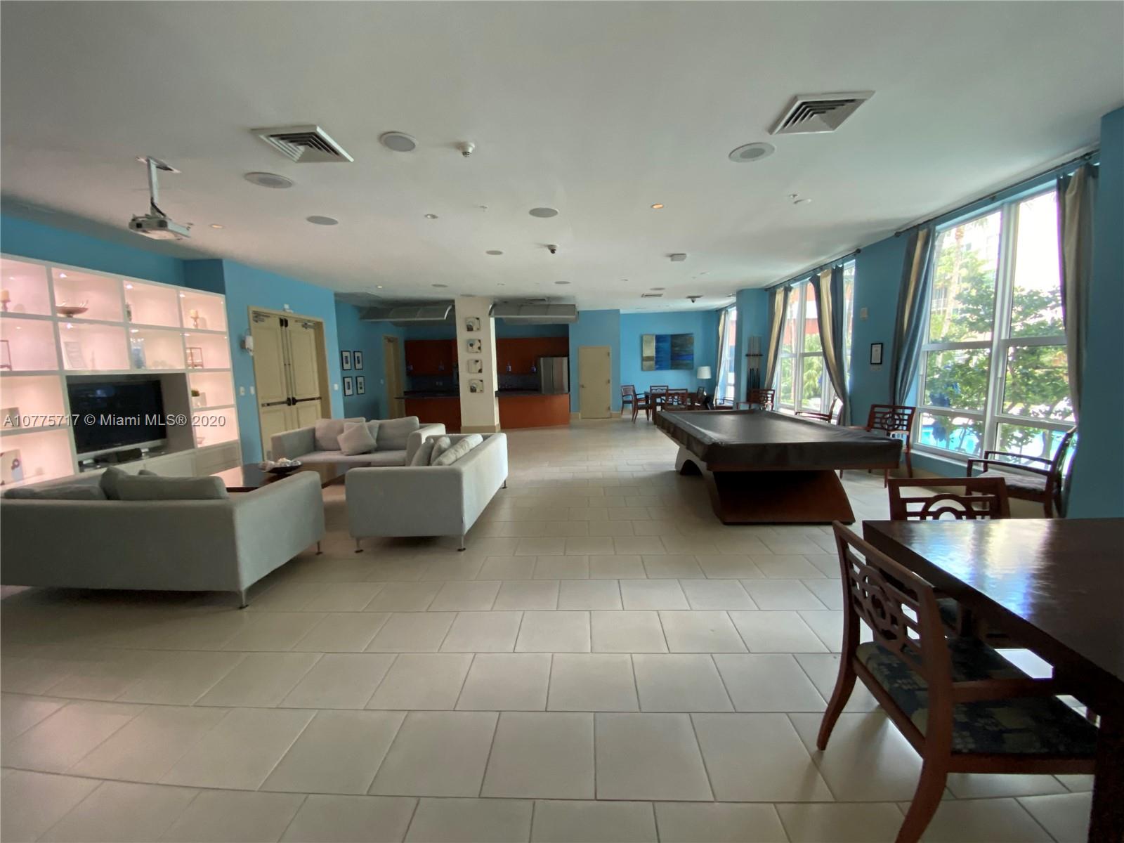 2000 North Bayshore Drive, Unit 407 Miami, FL 33137 - Photo 15 of 19 a living room with furniture and a flat screen tv