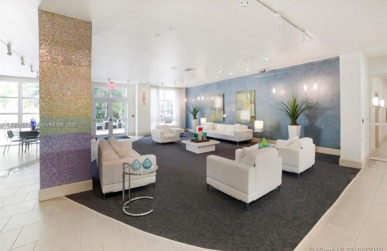 2000 North Bayshore Drive, Unit 407 Miami, FL 33137 - Photo 18 of 19 a living room with furniture and a couch