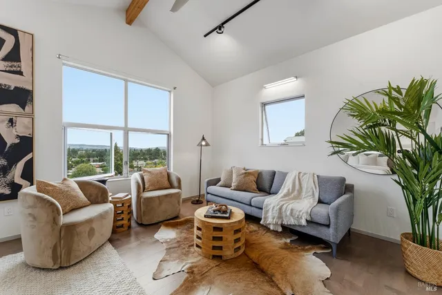 a bathroom with a granite countertop toilet sink and mirror
