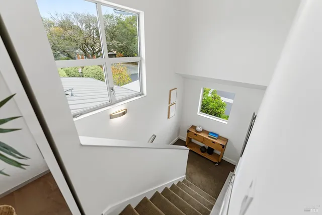 a view of a patio with a table and chairs