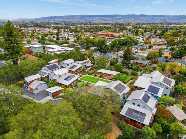 a aerial view of a house with swimming pool garden and patio