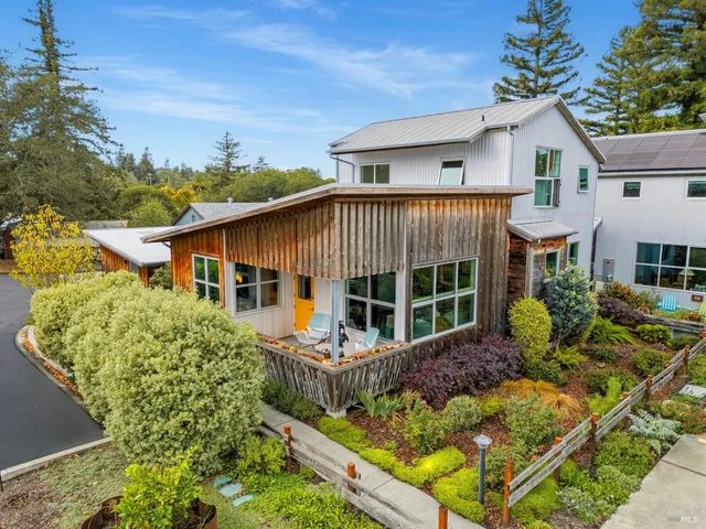 a view of a street with a building in the background