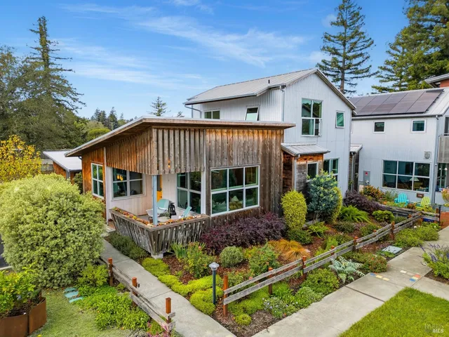 a living room filled with furniture and a window