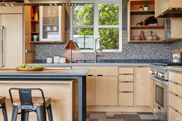 a dining room with a table and chairs