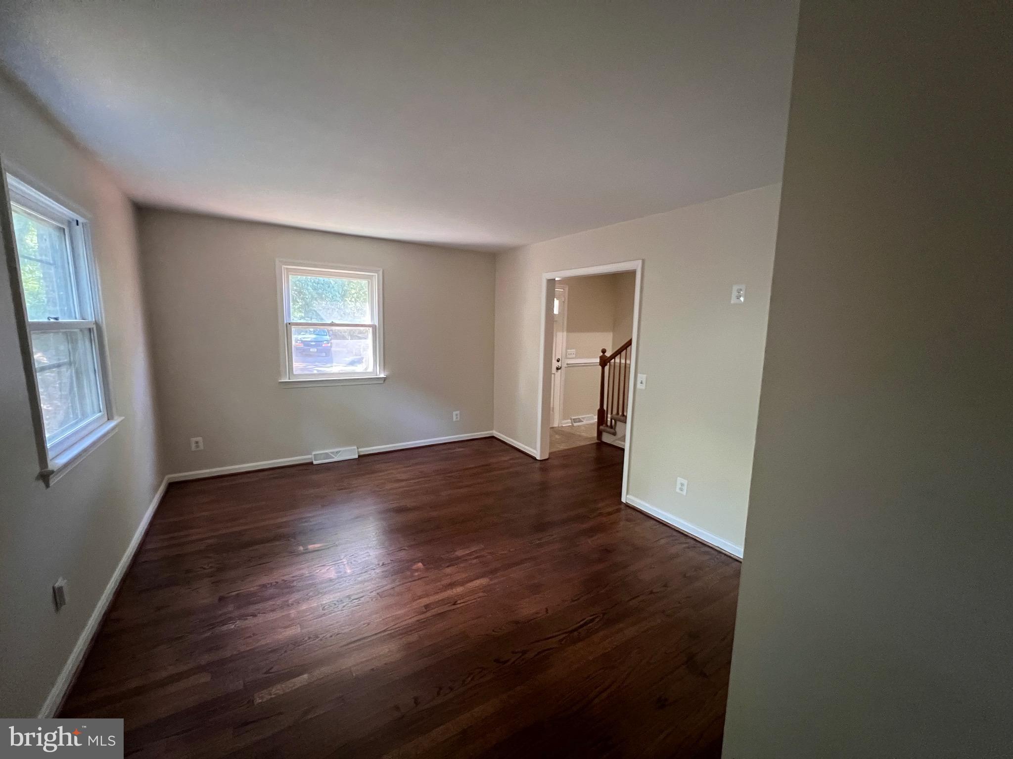 439 Ridgemore Street Fredericksburg, VA 22405 - Photo 16 of 17 a view of an empty room with wooden floor and a window