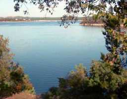a view of lake with green space