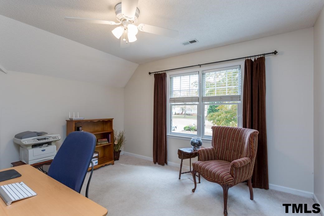 1241 Hillingdon Way Raleigh, NC 27614 - Photo 17 of 21 Currently used as an office, this Bedroom has access to TONS of storage. Not only does it have a great closet, but access doors to two separate attic storage spaces that are floored!