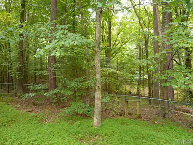 1241 Hillingdon Way Raleigh, NC 27614 - Photo 20 of 21 Great shaded and fenced yard is easy to enjoy. Small pond beyond the fence is in the neighboring property. Word has it you might enjoy a roaming horse or deer every now and again... Nature lovers, rejoice!