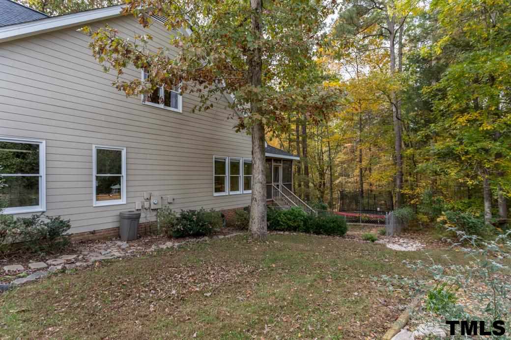 1241 Hillingdon Way Raleigh, NC 27614 - Photo 21 of 21 Great space to enjoy in the fenced back yard! Check out the mature trees in the wooded lot beyond.