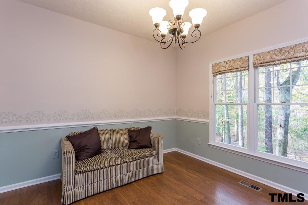 1241 Hillingdon Way Raleigh, NC 27614 - Photo 8 of 21 Currently being used as a flex space, this room is well-suited as Dining Room, located just off of the Kitchen and Family Rooms, this is a central gathering spot of the home. Beautiful molding and view to the back yard!