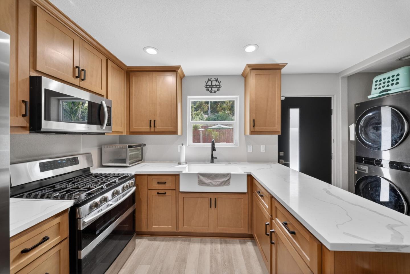 919 Old Canyon Road Fremont, CA 94536 - Photo 34 of 55 a kitchen with a sink stove and refrigerator