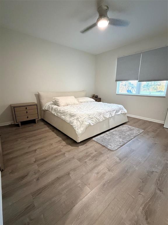 5684 Western Sun Drive St. Cloud, FL 34771 - Photo 14 of 16 a bedroom with a bed and a table