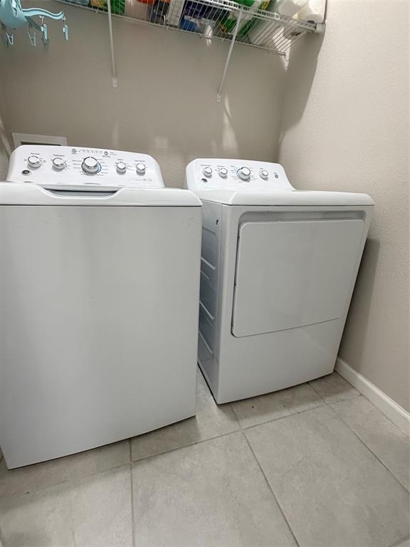 5684 Western Sun Drive St. Cloud, FL 34771 - Photo 15 of 16 a utility room with dryer and washer
