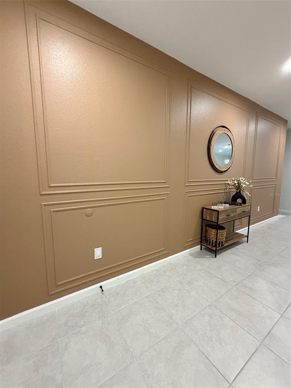 5684 Western Sun Drive St. Cloud, FL 34771 - Photo 3 of 16 a view of a room with a table and a chair
