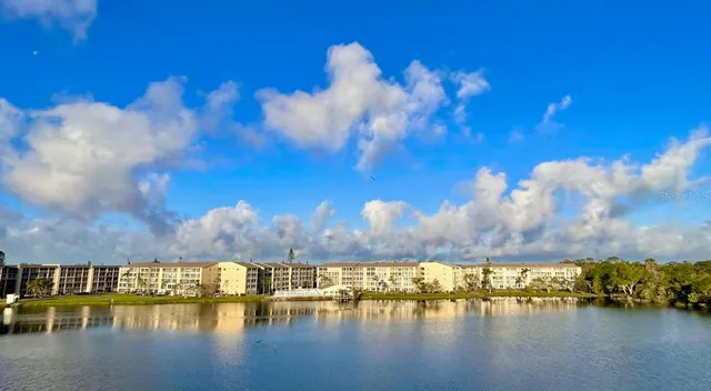 a view of a lake with lots of residential buildings in ocean