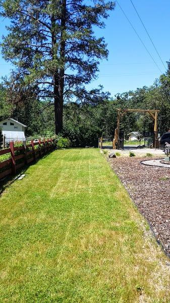 8906 North Applegate Road Grants Pass, OR 97527 - Photo 31 of 33 a view of swimming pool with a yard