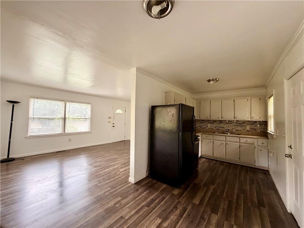 3151 Bluebird Lane Decatur, GA 30032 - Photo 4 of 16 a kitchen with stainless steel appliances granite countertop a refrigerator a stove and a wooden floors