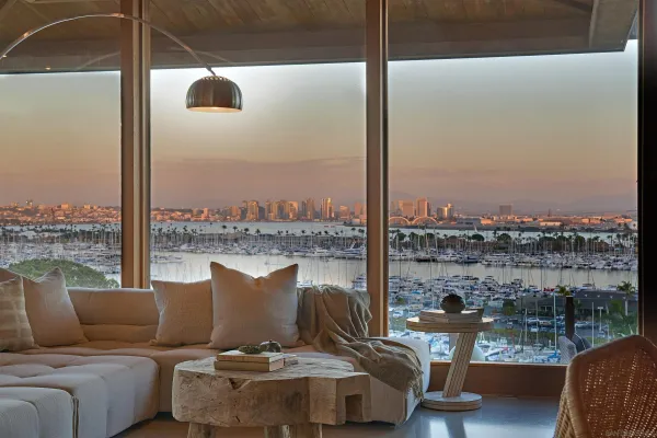 a balcony with furniture and city view