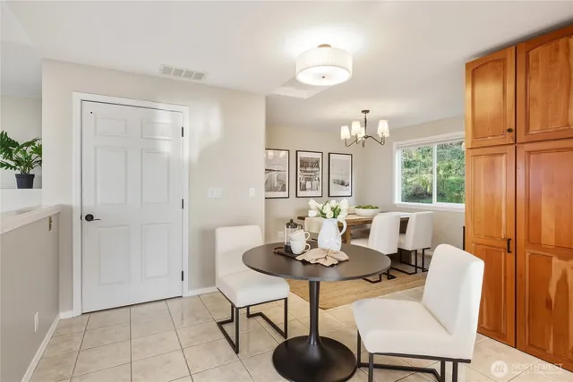 a view of a dining room with furniture window and outside view