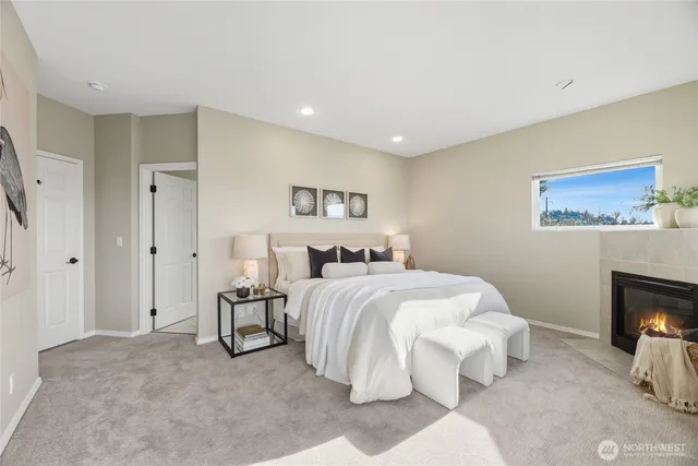 a spacious bedroom with a bed and a couch