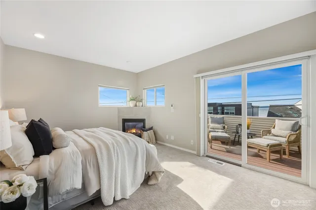 a bedroom with a bed and a view of kitchen